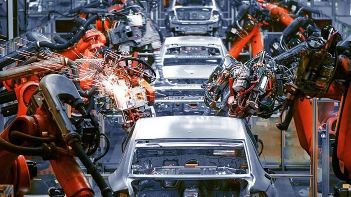 The welding arm on the automobile production line is being welded